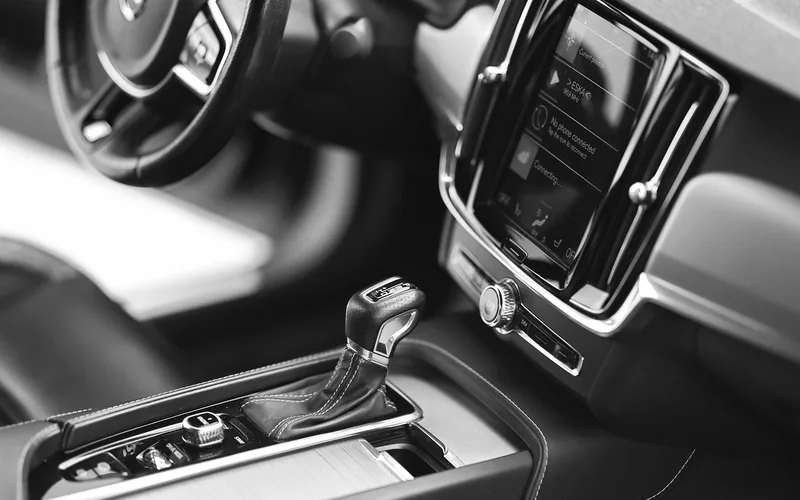 Car center console near the gear shift lever where the physical Auto Start/Stop A button is typically located
