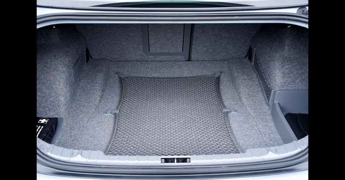 Empty car trunk cargo area with cargo net installed