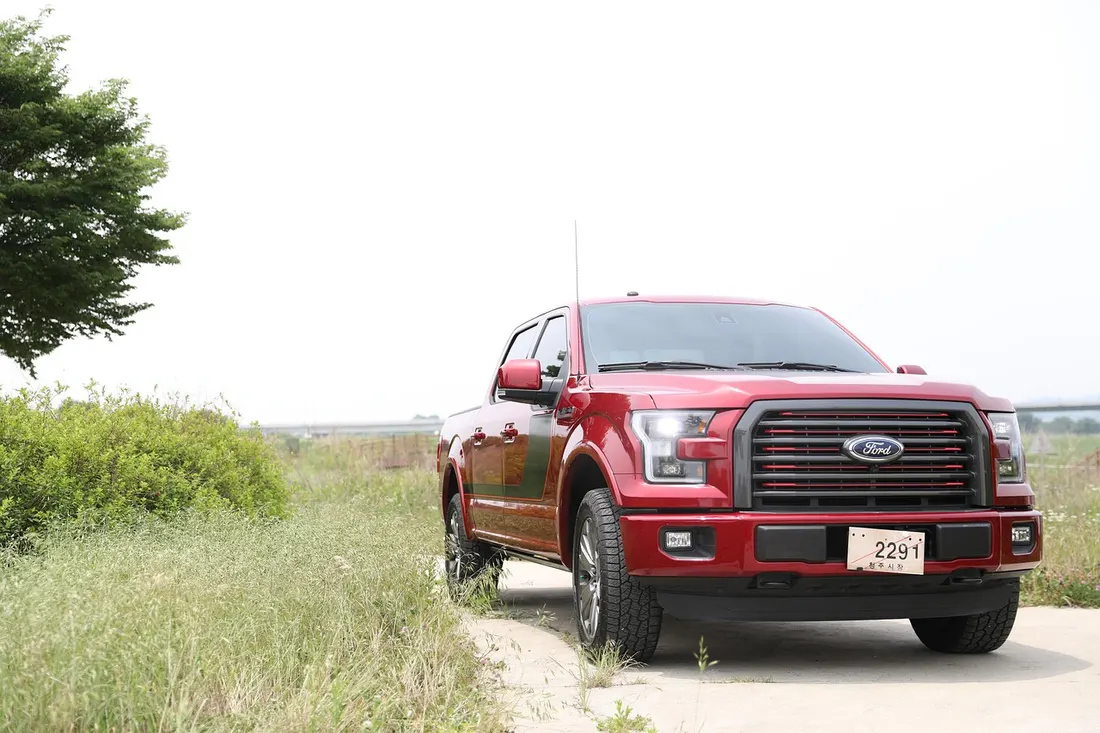 Red Ford F-150 pickup truck, one of the trucks compared for its 5.0-liter V8 engine