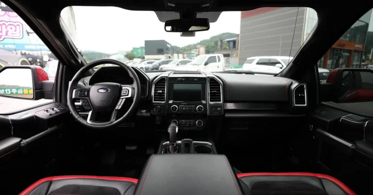 Ford truck dashboard with SYNC touchscreen and steering wheel Ford badge