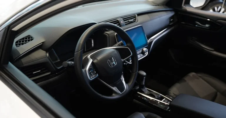 Honda steering wheel and touchscreen inside a Honda cabin