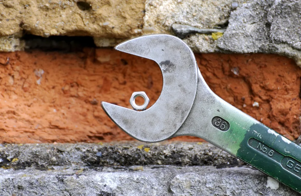 A wrench used for routine engine maintenance work