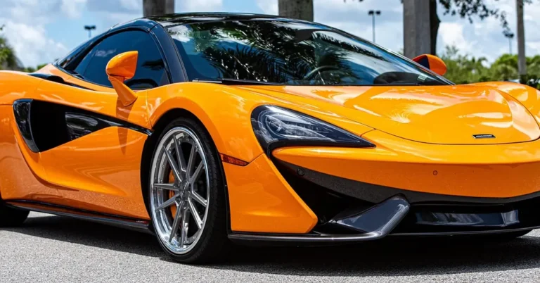 Orange McLaren supercar parked, showing its low, aerodynamic body
