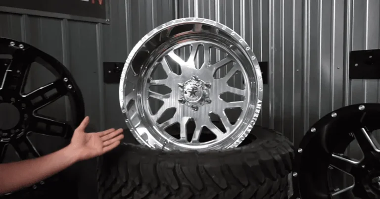 Chrome aftermarket 6-lug wheels on display in a shop