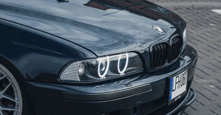 Close-up of a BMW car front grille and headlight with badge visible
