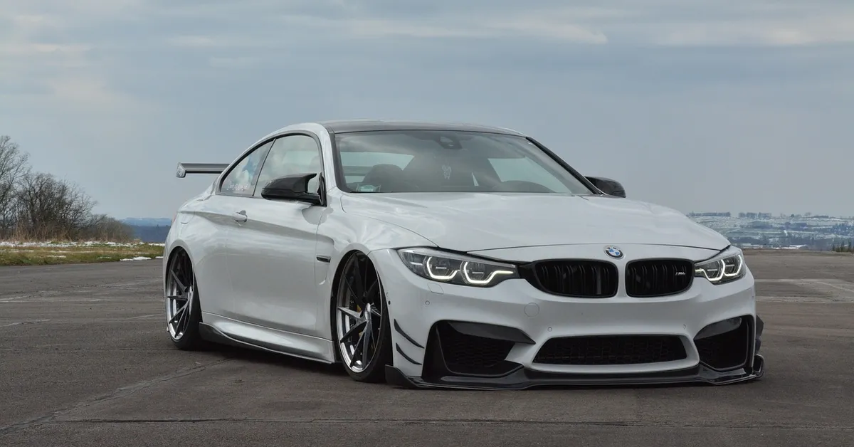 White BMW M4 front three-quarter view