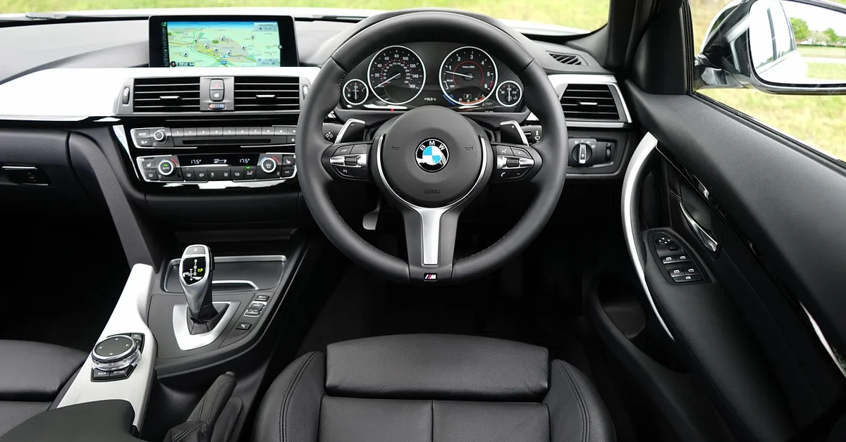 BMW dashboard and steering wheel showing the interior trim compared in Sensatec vs leather