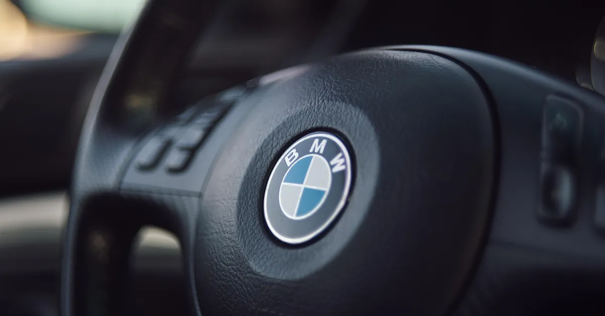 BMW steering wheel airbag cover with roundel logo closeup