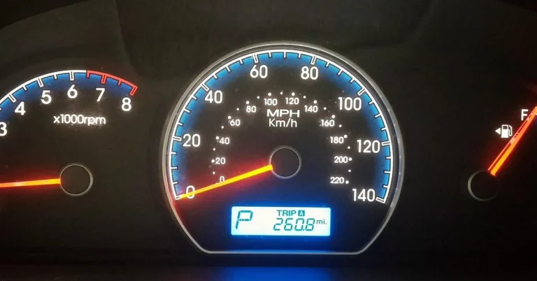 Car dashboard gauge cluster showing RPM and speed