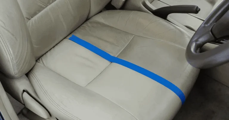 Beige leather car seat mid-cleaning with a visible clean line