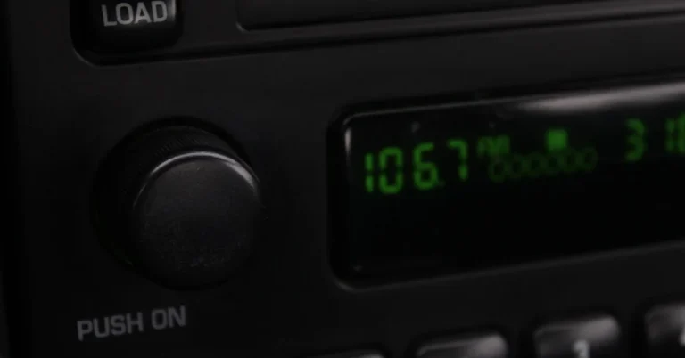 Car radio and dashboard controls closeup