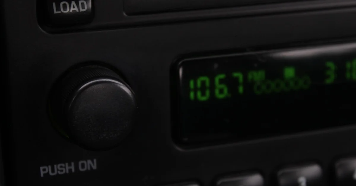 Car radio and dashboard controls closeup
