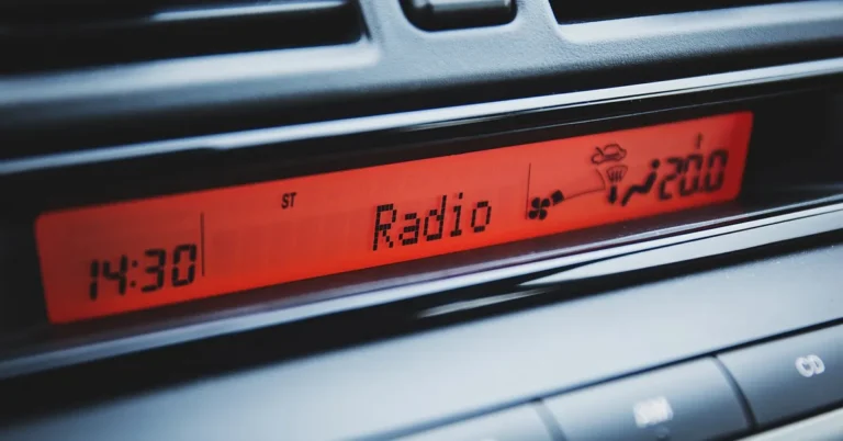 Close-up of a car radio dashboard display