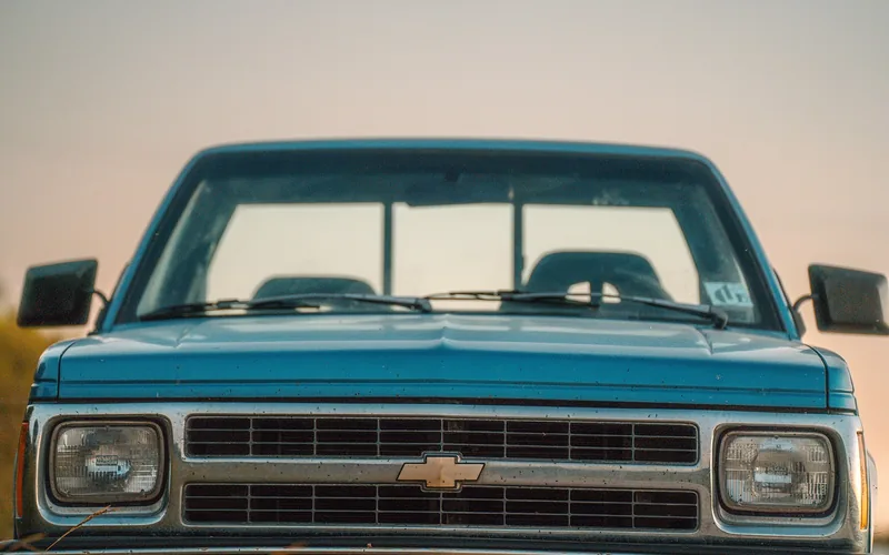 Front grille and headlights of a classic Chevy pickup truck with bowtie badge Front grille and headlights of a classic Chevy pickup truck with bowtie badge