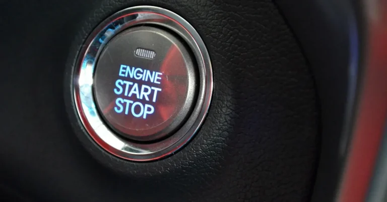 Close-up of an Engine Start Stop push button on a car dashboard