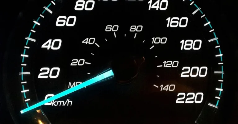 Close-up of a car speedometer and PRNDS gear indicator, illustrating the instrument cluster display used to check oil life percentage