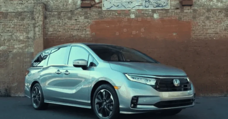 Silver Honda Odyssey minivan front view with Honda badge visible