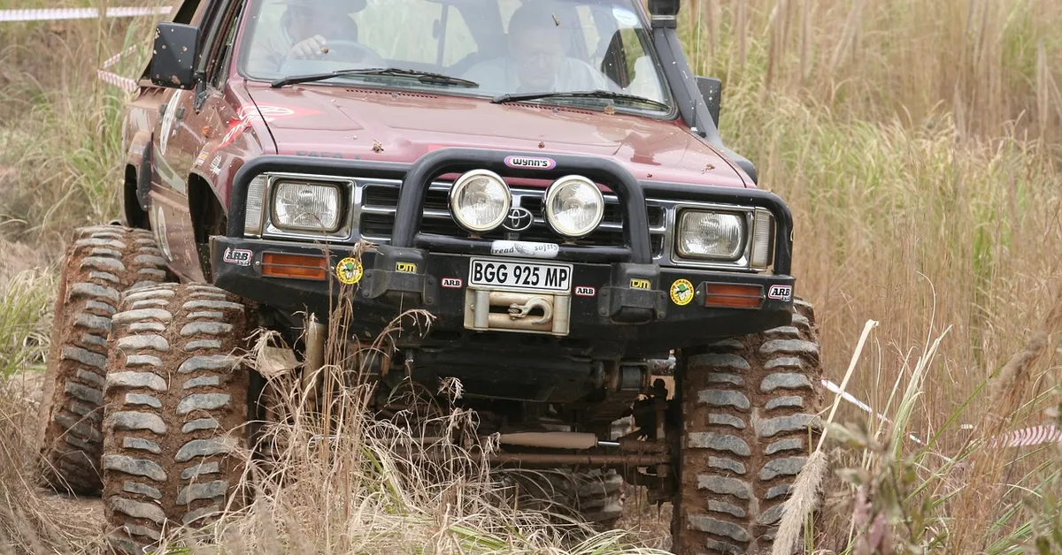 Toyota off-road truck with knobby tires and visible badge