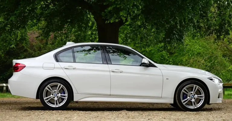 White BMW 3 Series with dark tinted roofline and windows