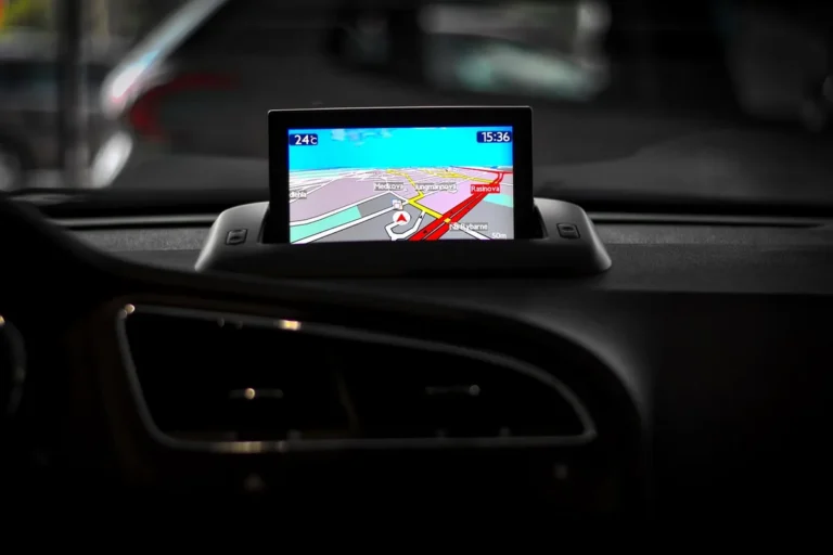 Dash-mounted navigation display showing a route map inside a car