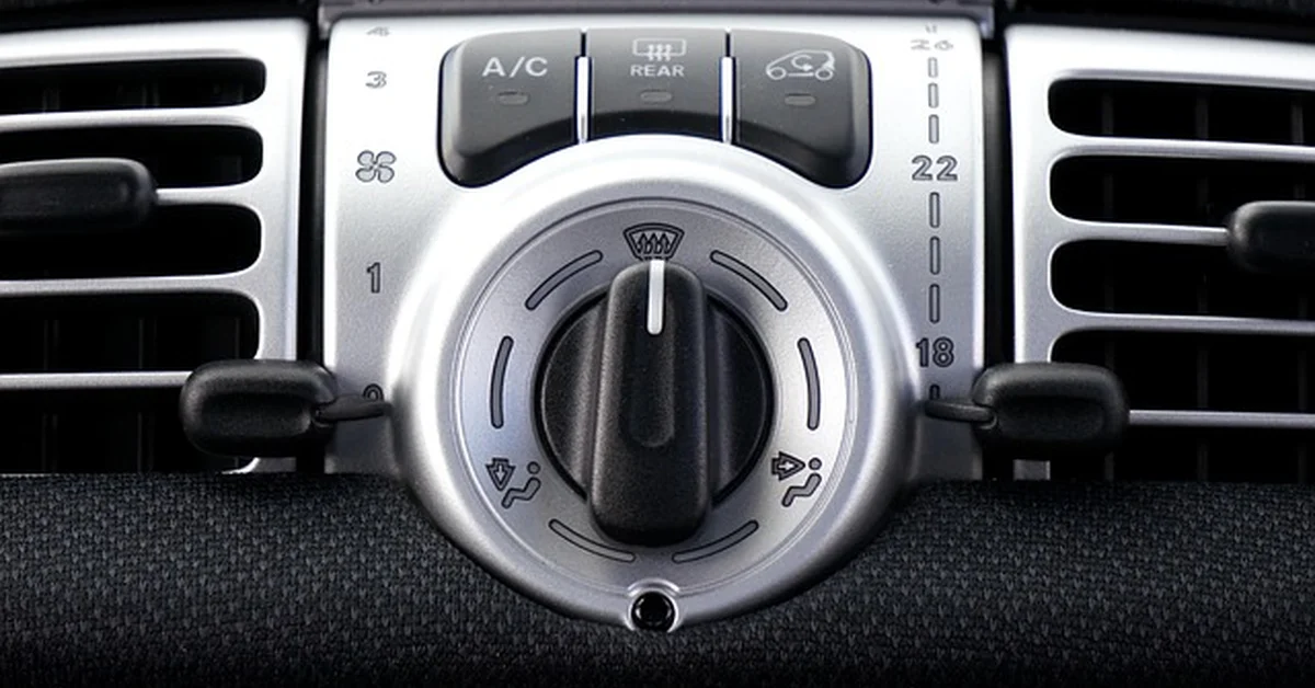 Car dashboard air conditioning vents and controls, relevant to repairing a car AC compressor