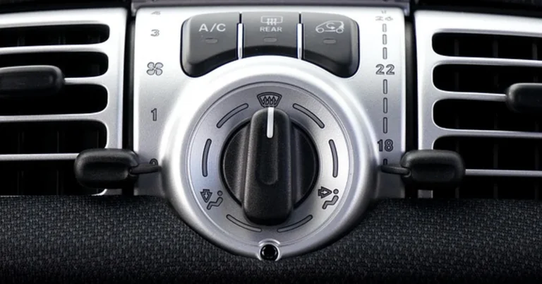 Car dashboard air conditioning vents and controls, relevant to AC compressor Freon leaks