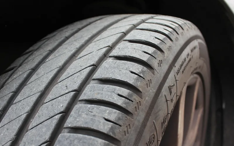 Close-up of a car tire tread and sidewall