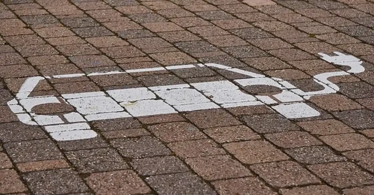 An electric vehicle charging station parking spot marking, relevant to Level 3 DC fast charging for a Chevy Bolt