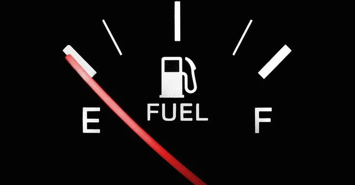 Car fuel gauge needle pointing toward empty, illustrating how far a Ford Fusion can travel on empty