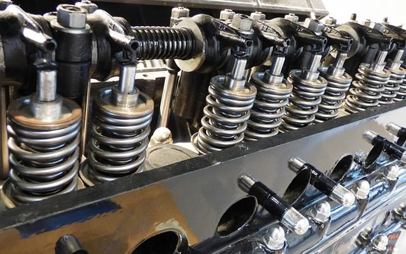 Clutch master cylinder fluid reservoir being topped off with fresh fluid during bleeding