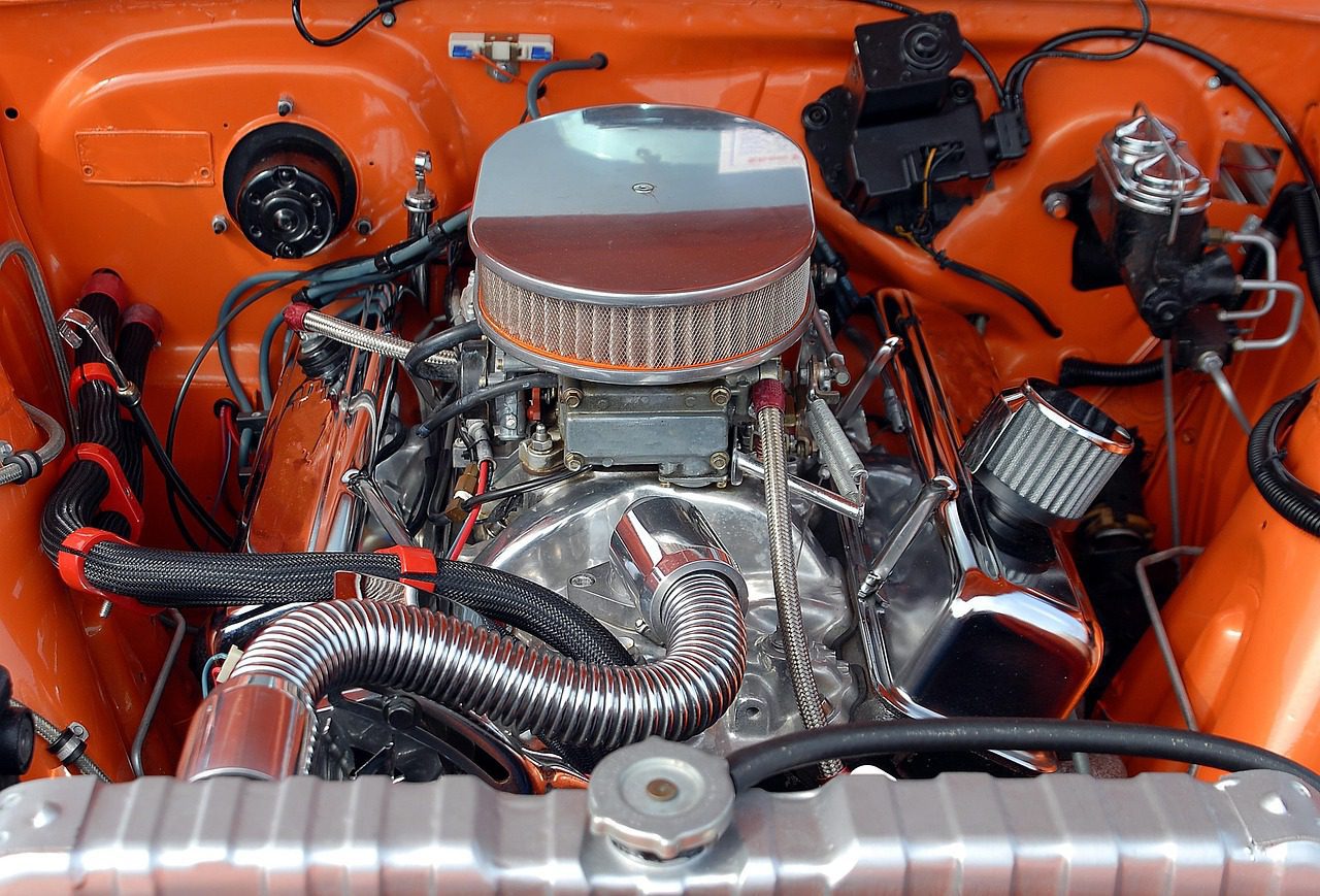 A mechanic using an OBD-II scanner to diagnose a Ford engine trouble code