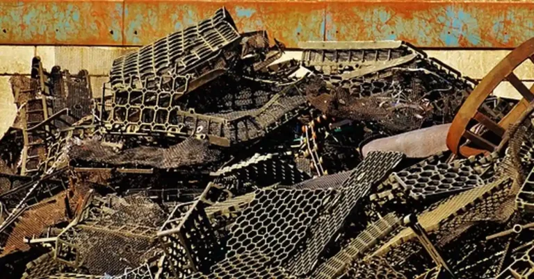 A pile of scrap steel at a junkyard, relevant to how powerful electromagnets lift cars onto scrapyard cranes