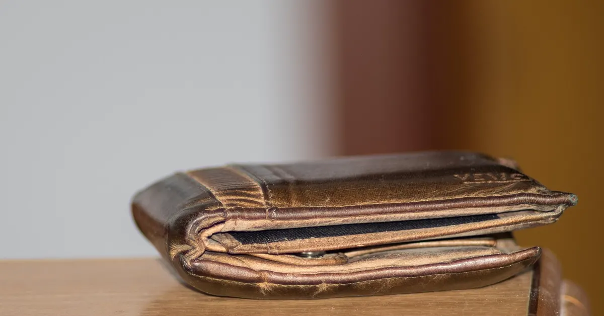 Money and tools, representing automotive technician earnings
