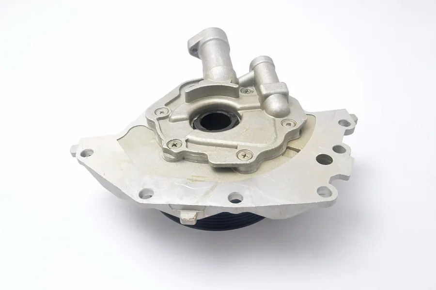 Aluminum engine oil pump on a white background