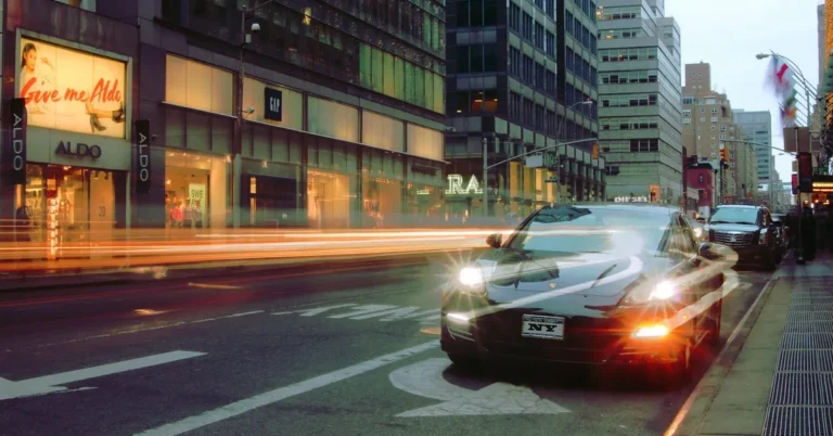 A car driving through a modern city street