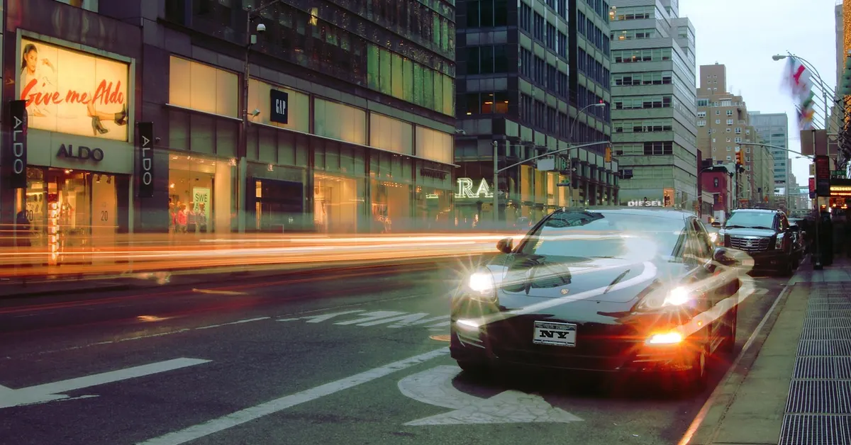 A car driving through a modern city street