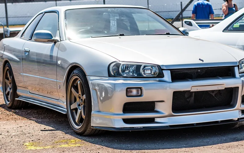 Tuned blue Nissan Skyline GT-R on display at a Japanese car show Tuned blue Nissan Skyline GT-R on display at a Japanese car show