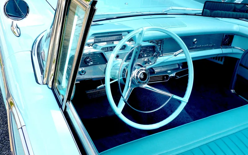 Vintage car dashboard with a classic AM radio dial, an early example of in-car music technology
