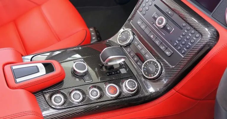 A car dashboard button panel including start-stop controls