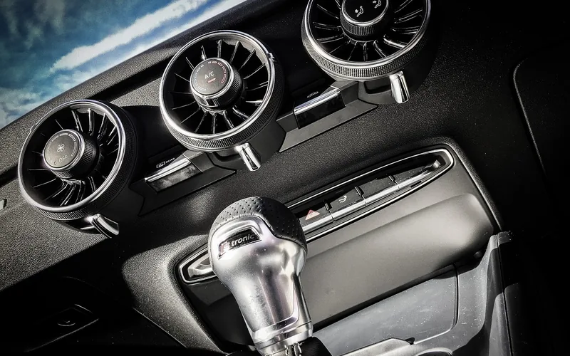 Car dashboard air vents that circulate cooled air from the AC system Car dashboard air vents that circulate cooled air from the AC system