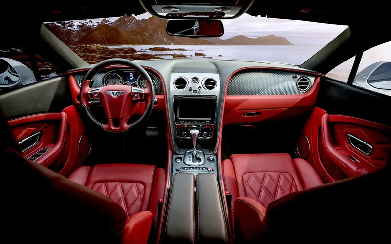 Red leather car interior with a center touchscreen and console Red leather car interior with a center touchscreen and console
