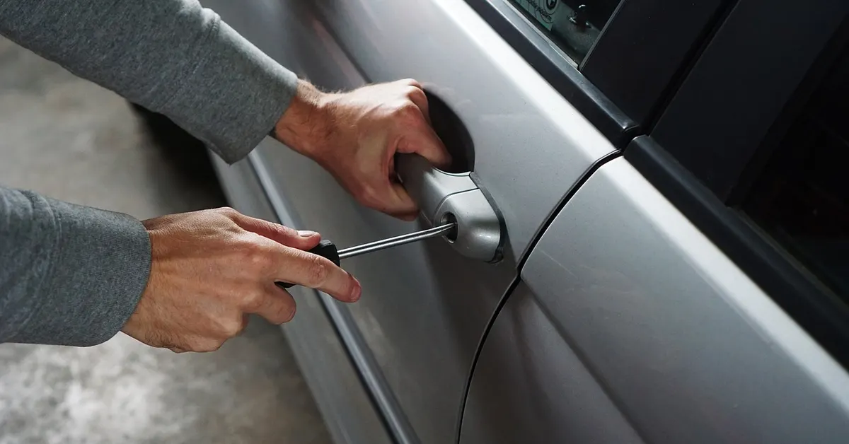 A break-in attempt on a parked car at night