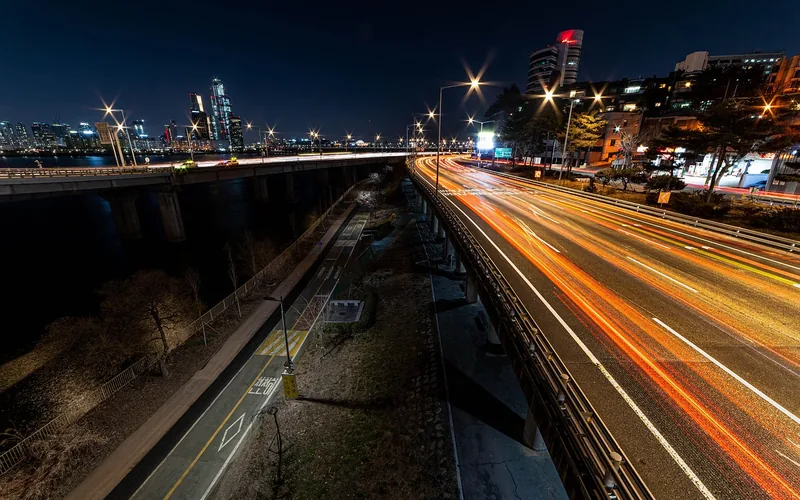 Seoul expressway beside the Han River at night with light trails