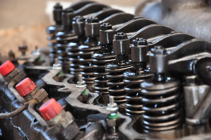 Row of valve springs and rocker arms on an engine cylinder head