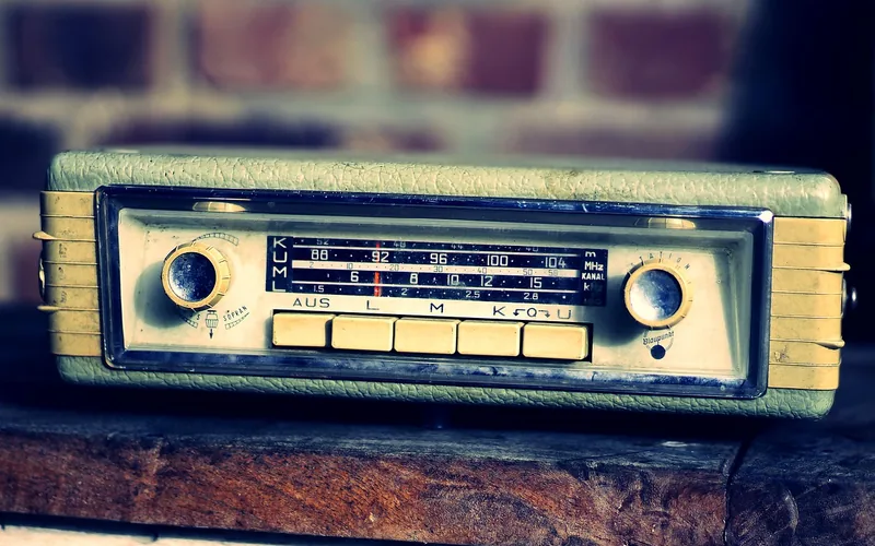 Vintage green car radio with tuning dial and preset buttons Vintage green car radio with tuning dial and preset buttons