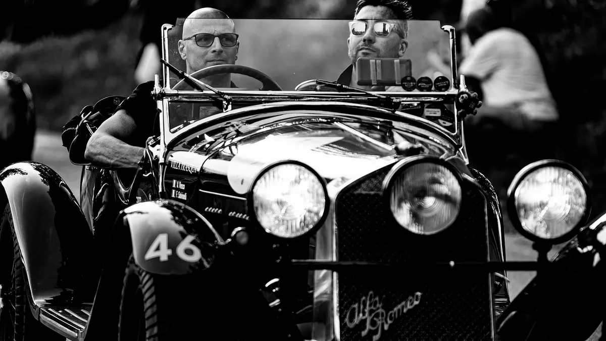 A restored vintage automobile representing the early era of car manufacturing in the late 1800s and early 1900s