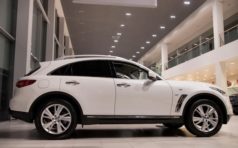 A new vehicle displayed in a car dealership showroom