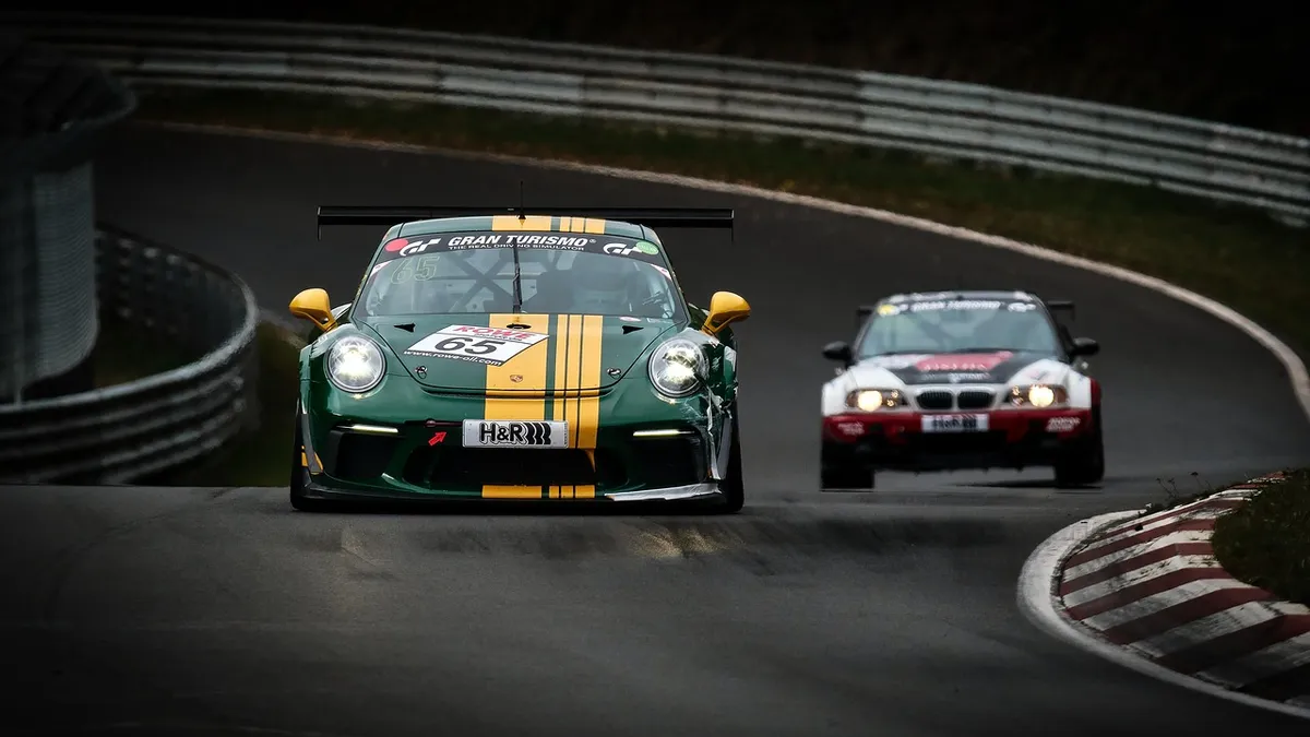 Sports car accelerating on a race track, the kind of engine sound writers describe with vroom or roar