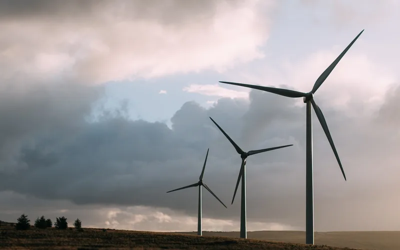 Wind turbines in a wind farm at sunset