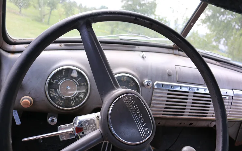 Driver's hands on a truck steering wheel that can shake at highway speed